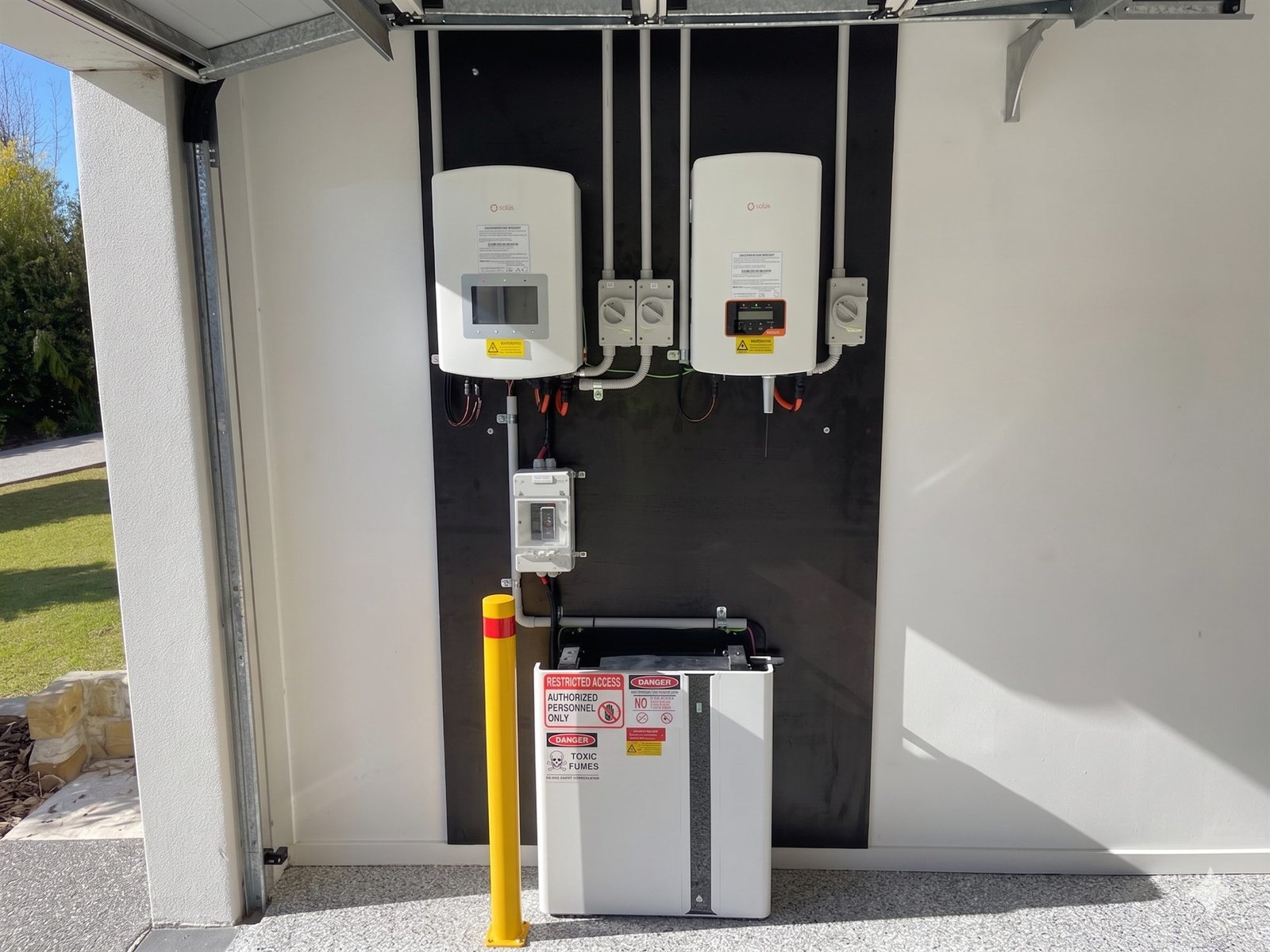 Hybrid solar inverters and battery installed in a Hunter Valley home carport