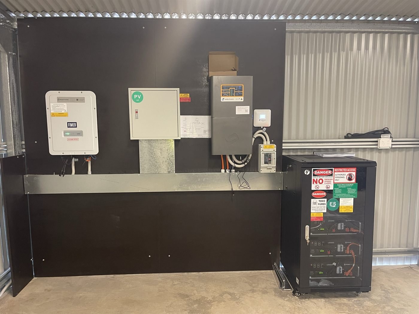 Off-grid switchboard with FIMER and Selectronic inverters in a container shed