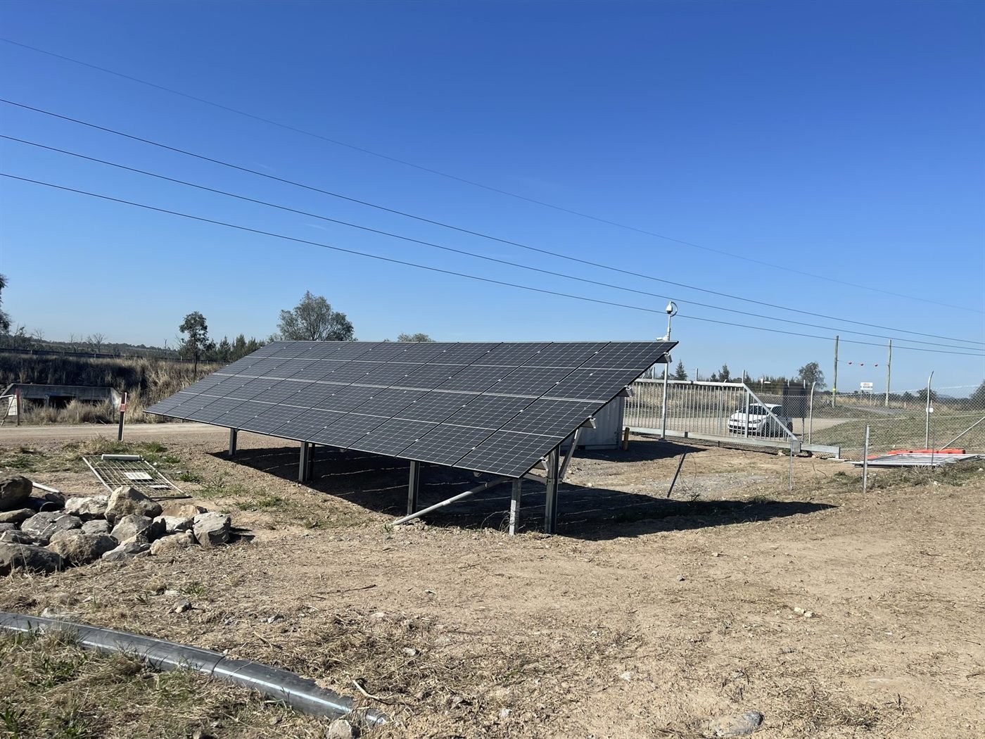 Off-grid solar array on a fenced rural property