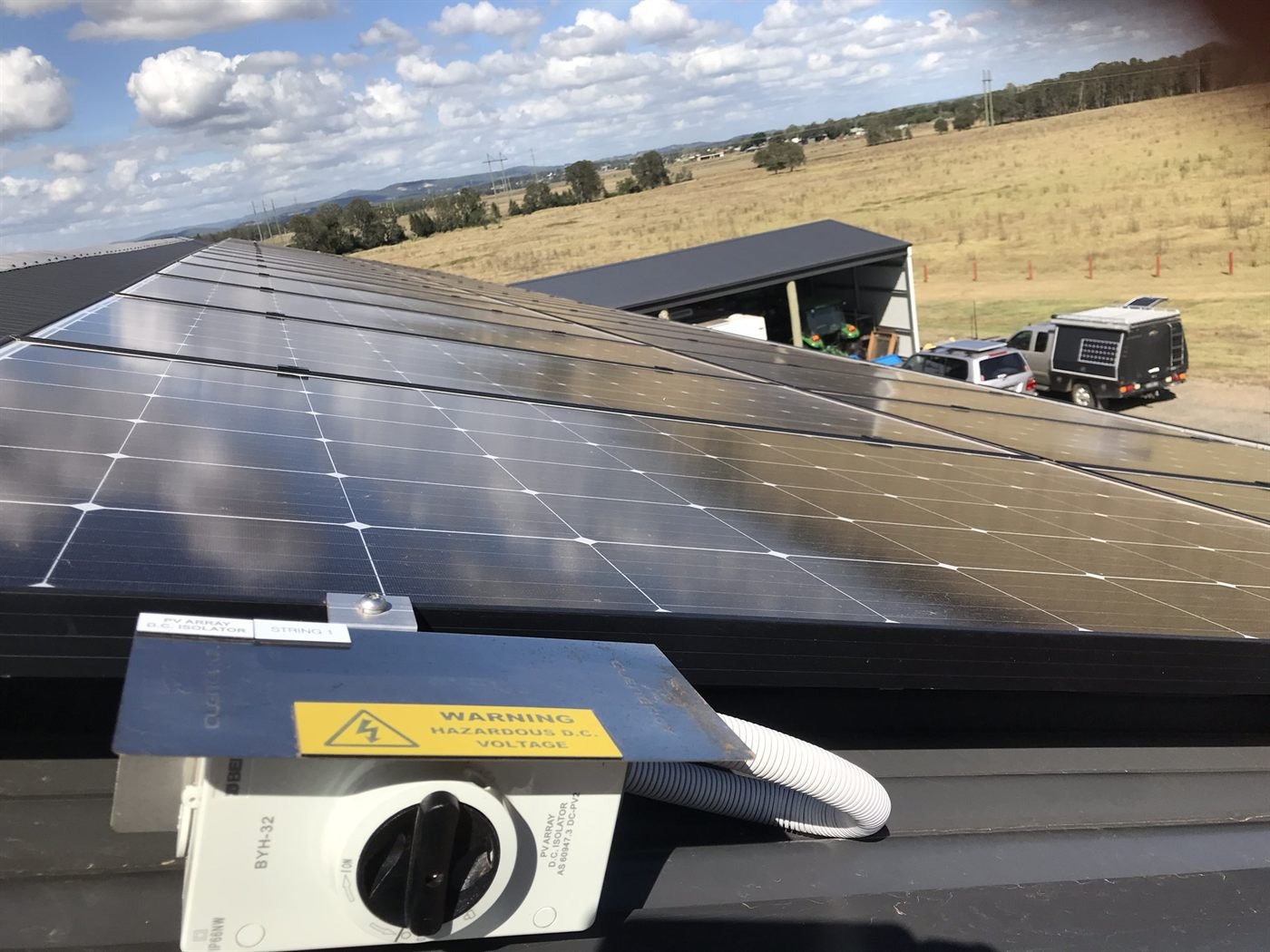 Close-up of solar panels on a rural property rooftop