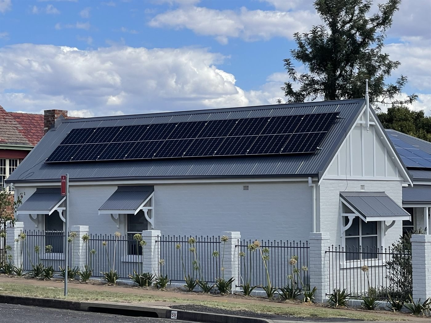 Solar panels on a heritage white home